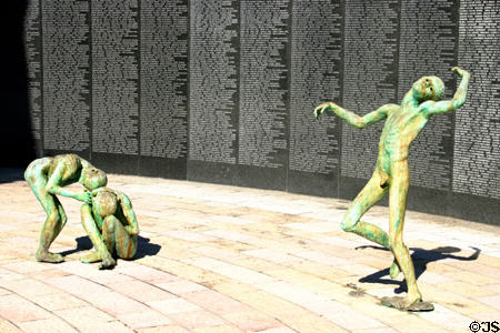 Skeletal statues in front of wall with names of victims at Holocaust Memorial. Miami Beach, FL.