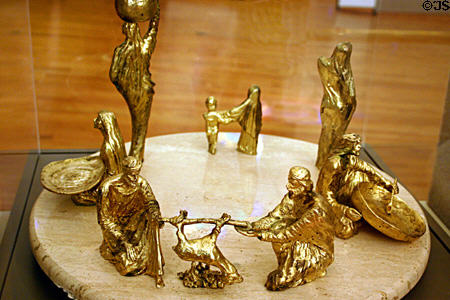 Passover Seder plate with gold-plated figures on marble base (1980) by A. Froman at Jewish Museum of Florida. Miami Beach, FL.