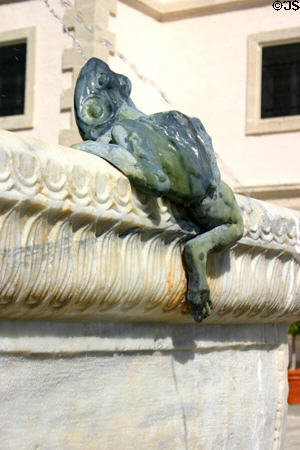 Sculpted frog climbs on fountain at Vizcaya Gardens. Miami, FL.