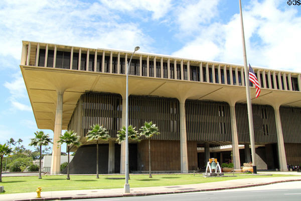 Hawaii State Capitol (1968) where columns suggest royal palm trees, reflecting pools symbolize ocean, & cone shaped legislative chambers symbolize volcanoes. Honolulu, HI.