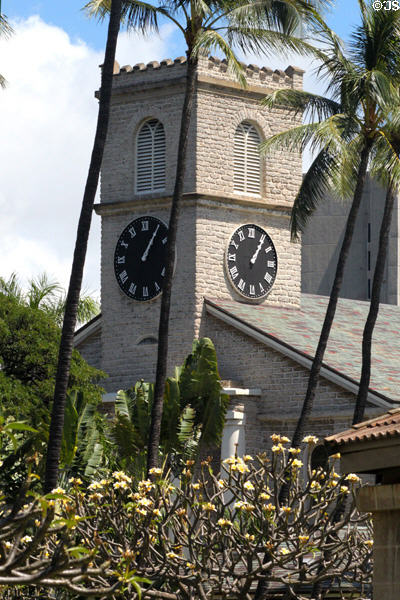 Clock tower of Kawaiaha'o Church through tropical plants. Honolulu, HI.