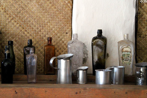 Antique glass bottles & tinware in Oldest Frame House of Mission House Museum. Honolulu, HI.