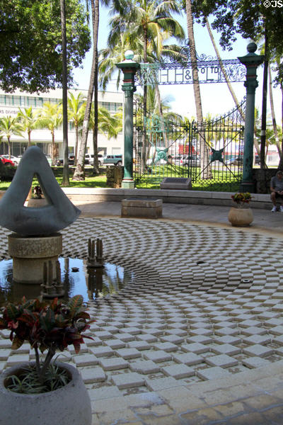 Original iron gates to H. Hackfeld & Co. with fountain in Walker Park at end of Fort St. Mall. Honolulu, HI.