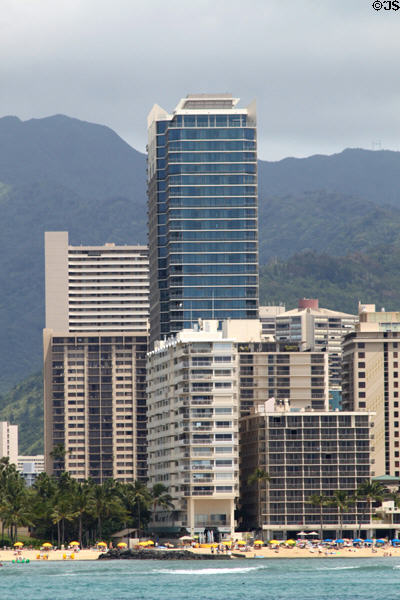 Trump International Hotel & Condos towers above surrounding highrises. Waikiki, HI.
