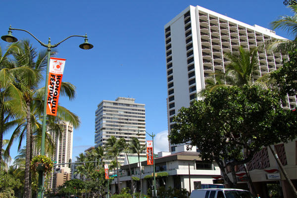 Kalakaua Ave. streetscape with Foster & Kealohilani Towers. Waikiki, HI.