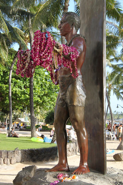 Lei covered Duke Paoa Kahanamoku statue (1990) by Jan-Michelle Sawyer. Waikiki, HI.