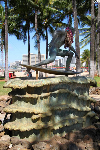 Surfer on a Wave sculpture (2003) by Robert Pashby on Waikiki Beach. Waikiki, HI.