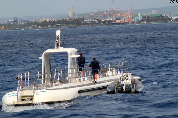 Atlantis XIV submarine with Honolulu docks in distance. Waikiki, HI.