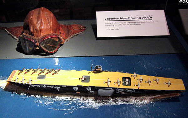 Japanese flight helmet & goggles (1941) & model of Japanese aircraft carrier Akagi used for attack on Pearl Harbor at U.S. Army Museum. Waikiki, HI.