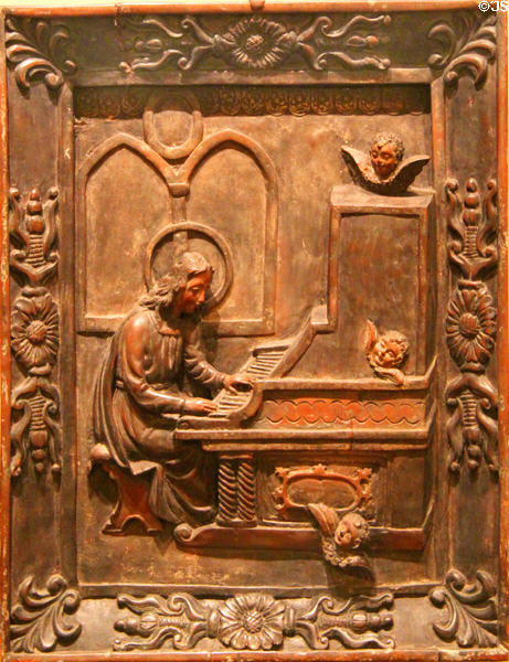 Philippine wood carving (19-20thC) of St Cecilia Playing an Organ at Honolulu Academy of Arts. Honolulu, HI.