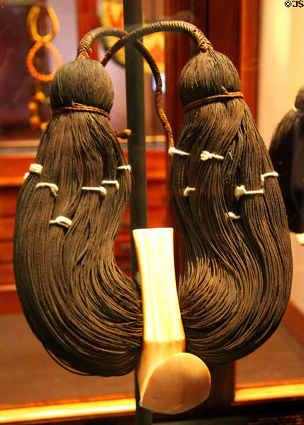 Lei Niho Palaoa Hawaiian chief's neck ornament (before 1923) with carved whale tooth on braided human hair at Bishop Museum. Honolulu, HI.