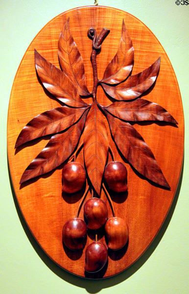 Carved wooden plaque of mangoes (before 1906) by Manuel Silva at Bishop Museum. Honolulu, HI.