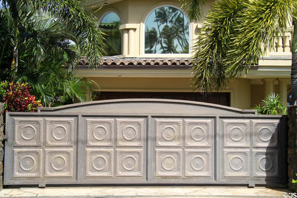 Artistic gate with classical medallions for home east of Waikiki. Honolulu, HI.