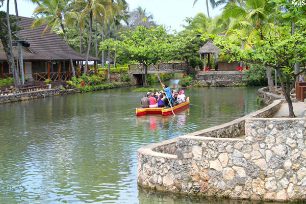 Tourists on canal boat at Polynesian Cultural Center. Laie, HI.
