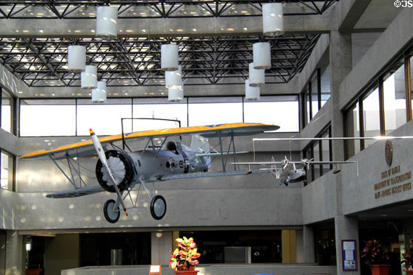 Antique Navy biplane hanging in lobby of Honolulu airport. HI.
