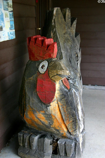 Carved rooster outside broom shop. West Amana, IA.
