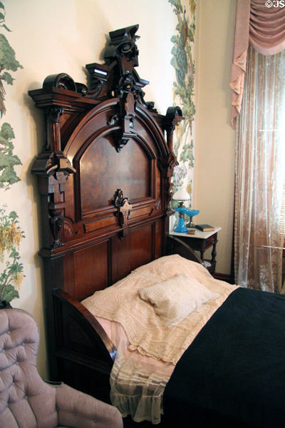 Headboard of walnut bedroom set (1876) from Ogden Hotel of Council Bluffs at Dodge House. Council Bluffs, IA.
