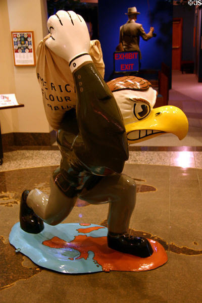 University of Iowa mascot Herky the Hawk by artist Lou Picek carrying flour sack to feed the world at Hoover Museum. West Branch, IA.