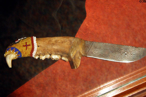 Native knife with beaded hilt of Kodiak bear jaw at Museum of Idaho. Idaho Falls, ID.