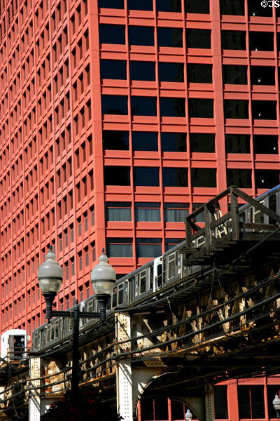 The loop metro rapid transit train & CNA Plaza. Chicago, IL.