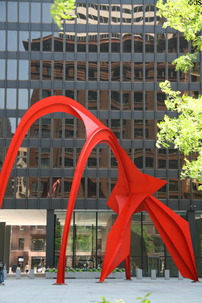 Flamingo (1974) sculpture by Alexander Calder in front of Federal Building which reflects Marquette Building. Chicago, IL.