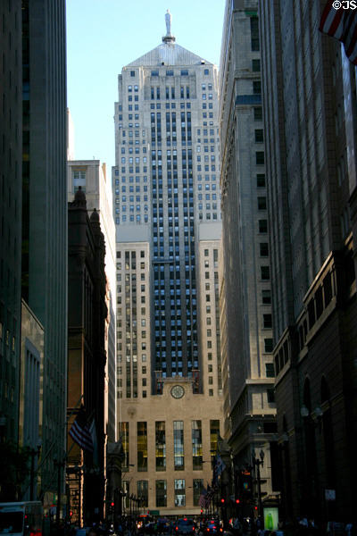 Chicago Board of Trade towers at end of an urban canyon. Chicago, IL.