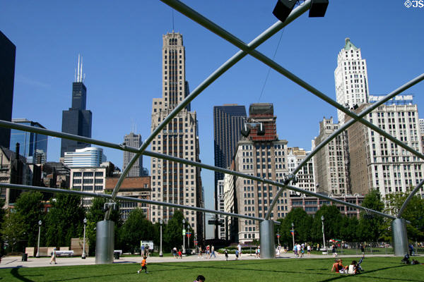 Skyscrapers along Michigan Av. seen through the trellis over the Great Lawn seating area for Gehry's Pritzker Pavilion in Millennium Park. Chicago, IL.