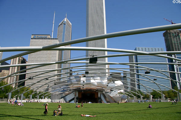 Jay Pritzker Pavilion (2001) in Millennium Park consists of open air concert venue with 4,000 seats & the trellis which supports a sound system over the Great Lawn which accommodates an additional 7,000 listeners. Chicago, IL. Architect: Frank Gehry.