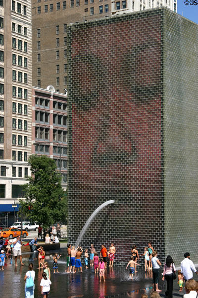 Crown Fountain tower face occasionally spits a stream of water on waders in Millennium Park. Chicago, IL.