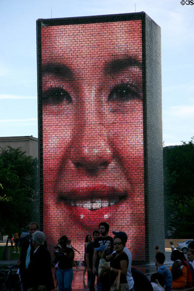 A thousand photos of faces from all ethnic groups are projected sequentially on the Crown Fountain Towers which contain arrays of LED screens in Millennium Park. Chicago, IL.