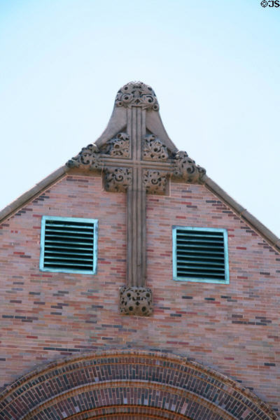 Sculpted cross on facade of St. Gabriel Church. Chicago, IL.