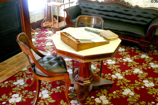 Portable writing desk on octagonal table in Lincoln home. Springfield, IL.
