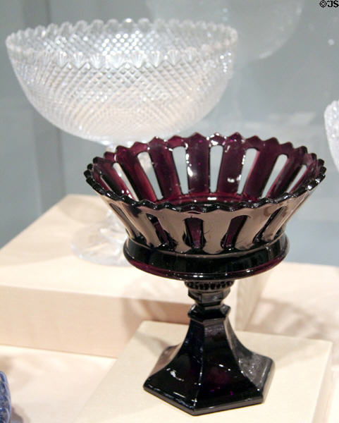 Pressed glass purple compote (1835-40) by Boston & Sandwich Glass Co. of Sandwich, MA before cut glass compote (1851-7) from New York City at Art Institute of Chicago. Chicago, IL.