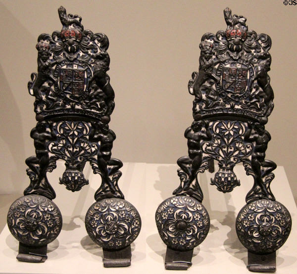 Pair of cast iron andirons (c1670) from England with coat of arms for House of Stuart at Art Institute of Chicago. Chicago, IL.