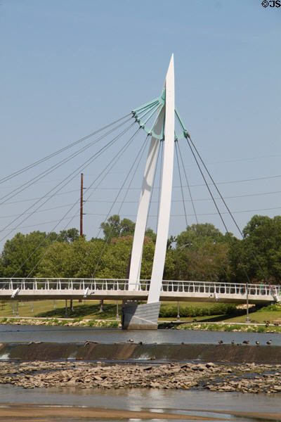 Pedestrian suspension bridge structure (2007) over Arkansas Rivers. Wichita, KS. Architect: HNTB.