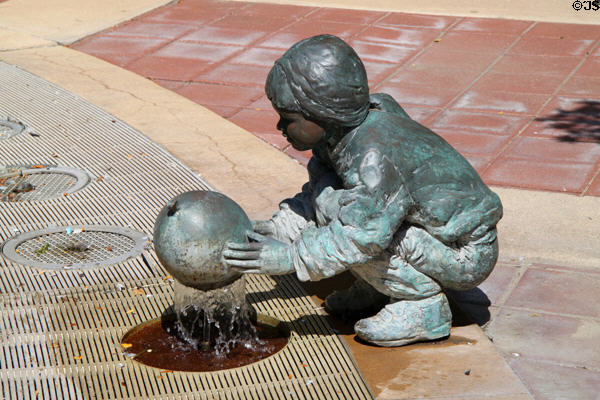 Sculpted child with ball fountain (2000) by Georgia Gerber in Reflection Square Park on Douglas Street. Wichita, KS.