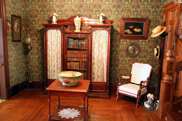 Reception room with bookcase (c1890) in recreated Wichita Cottage (c1890) at Sedgwick County Historical Museum. Wichita, KS.