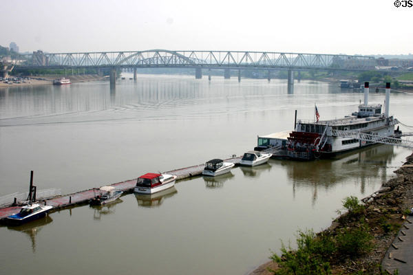 Ohio River with paddlewheel steamboat docked. Covington, KY.
