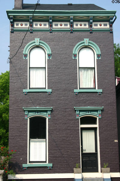 Narrow purple house with blue trim (527 Russell St.). Covington, KY. Style: Italianate Saltbox.