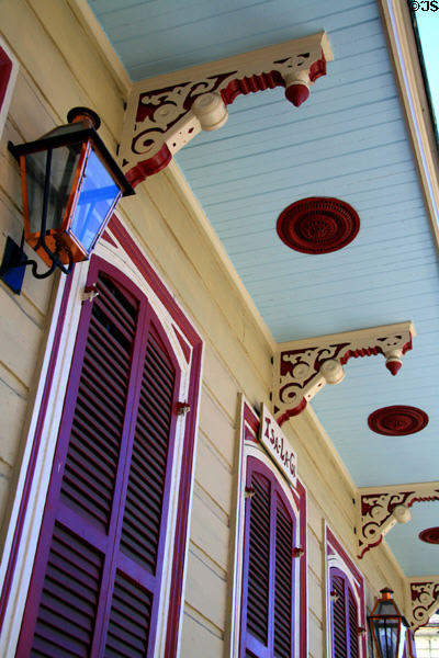 Shotgun house with red trim & purple shutters (1212 Bourbon St.). New Orleans, LA.