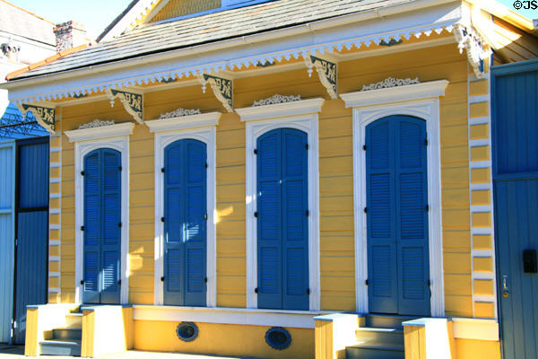 Bright yellow & blue shotgun houses (1030-32 Dauphine St.). New Orleans, LA.