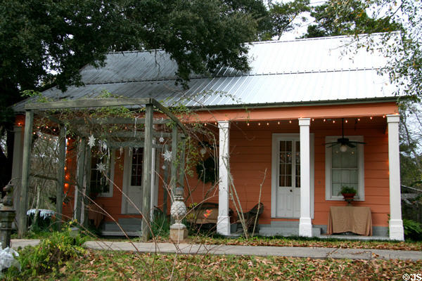 Orange Creole-style cottage (9721 Royal St.). St. Francisville, LA.
