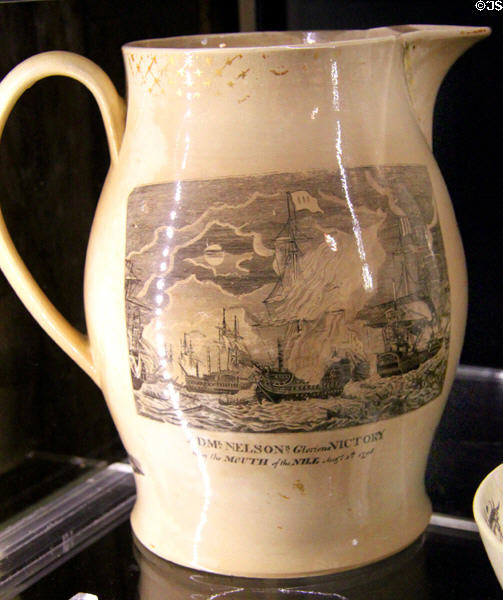 Creamware pottery jug showing Arm. Nelson's Victory near mouth of the Nile (1798) at New Bedford Whaling Museum. New Bedford, MA.