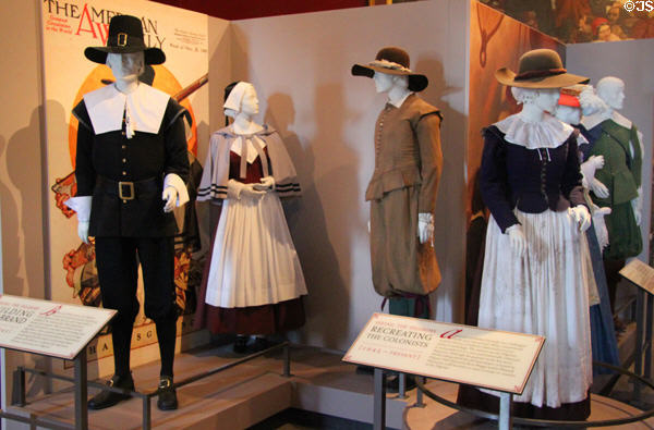 Pilgrim dress according to mythology (left couple) & closer to reality (right couple) at Pilgrim Hall Museum. Plymouth, MA.