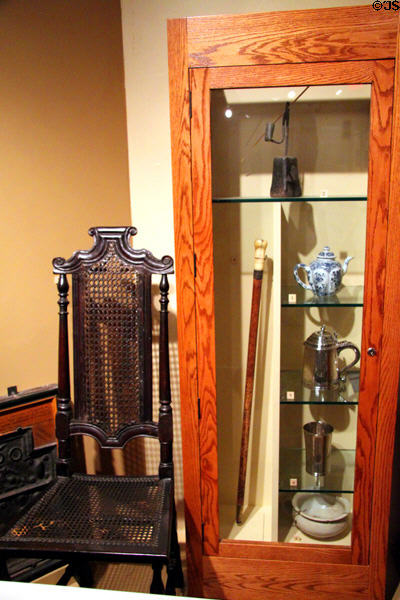 Cane chair, rushlight holder, cane, teapot, tankard & beaker (all c 1650-1700) at Pilgrim Hall Museum. Plymouth, MA.