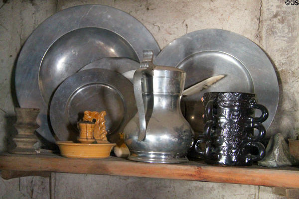 Pewter plates & household items at Plimouth Plantation. Plymouth, MA.