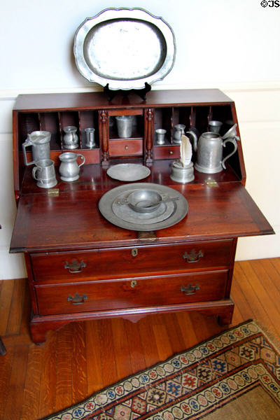 Pewter collection on drop front desk at Mayflower Society House. Plymouth, MA.