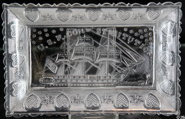 Pressed lacy glass tray of USF Constitution (1832-33) by Boston & Sandwich Glass Co. at Sandwich Glass Museum. Sandwich, MA.