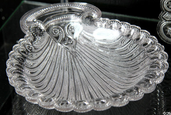 Pressed lacy glass peacock or hairpin design dish (1830-40) by Boston & Sandwich Glass Co. at Sandwich Glass Museum. Sandwich, MA.