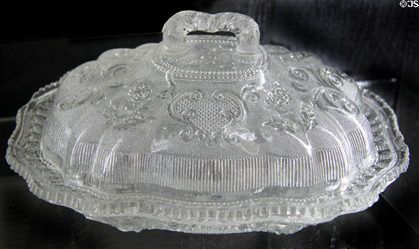 Pressed glass lacy princess-feather medallion design covered dish (1830-45) by Boston & Sandwich Glass Co. at Sandwich Glass Museum. Sandwich, MA.